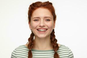 young positive ginger young female smiling photo