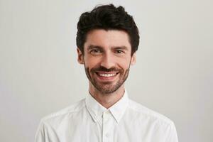 young male standing over white background photo