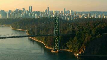 Aerial view of Lions Gate Bridge and Stanley Park at dawn. Canada video