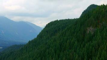 Aerial view of Canadian mountain landscape in cloudy day. Taken near Vancouver video