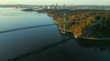 Aerial view of Lions Gate Bridge and Stanley Park at dawn. Canada video