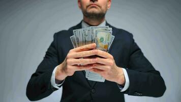 Formally dressed man counting US Dollar bills, close-up. video