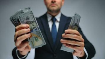 Formally dressed man counting US Dollar bills, close-up. video