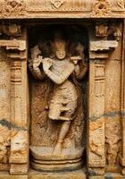 Krishna bas relief in Hindu temple. Sri Ranganathaswamy Temple. Tiruchirappalli, Tamil Nadu, India photo