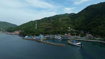 Gorontalo, Indonesia - January 5, 2024 - Aerial View of the Ferry Approaching the Port of Gorontalo, Gorontalo City in the Morning photo