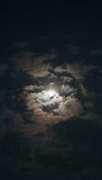 Beautiful magic blue night sky with clouds and full moon photo