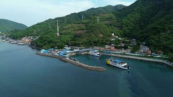 Gorontalo, Indonesia - January 5, 2024 - Aerial View of the Ferry Approaching the Port of Gorontalo, Gorontalo City in the Morning photo