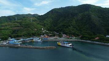 Gorontalo, Indonesia - January 5, 2024 - Aerial View of the Ferry Approaching the Port of Gorontalo, Gorontalo City in the Morning photo