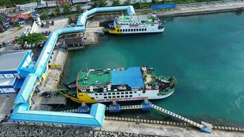 Gorontalo, Indonesia - January 5, 2024 - Aerial View of the Ferry Approaching the Port of Gorontalo, Gorontalo City in the Morning photo