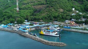 Gorontalo, Indonesia - January 5, 2024 - Aerial View of the Ferry Approaching the Port of Gorontalo, Gorontalo City in the Morning photo