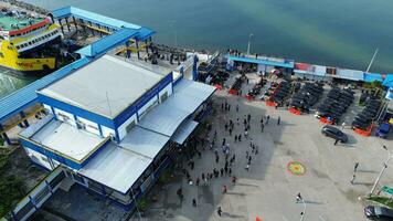 Gorontalo, Indonesia - January 5, 2024 - Aerial View of the Ferry Approaching the Port of Gorontalo, Gorontalo City in the Morning photo