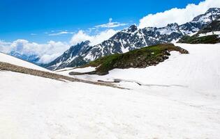 Landscape in the mountains. Panoramic view from the top of Sonmarg, Kashmir valley in the Himalayan region. meadows, alpine trees, wildflowers and snow on mountain in india. Concept travel nature. photo