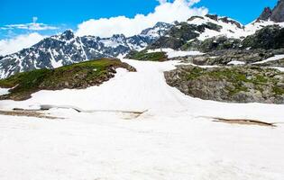 Landscape in the mountains. Panoramic view from the top of Sonmarg, Kashmir valley in the Himalayan region. meadows, alpine trees, wildflowers and snow on mountain in india. Concept travel nature. photo