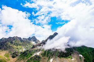 Landscape in the Himalayas Panoramic view from the top of Sonmarg, Nepal's Kashmir valley in the Himalayan region. Grasslands, wildflowers and mountain snow. hiking concept Nature camping, India photo