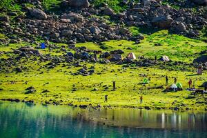 Landscape in the Himalayas Panoramic view from the top of Sonmarg, Nepal's Kashmir valley in the Himalayan region. Grasslands, wildflowers and mountain snow. hiking concept Nature camping, India photo