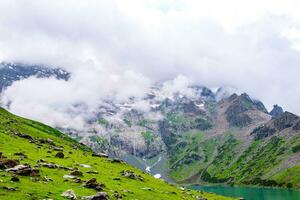 Landscape in the Himalayas Panoramic view from the top of Sonmarg, Nepal's Kashmir valley in the Himalayan region. Grasslands, wildflowers and mountain snow. hiking concept Nature camping, India photo