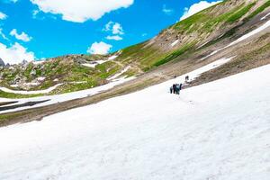 Landscape in the mountains. Panoramic view from the top of Sonmarg, Kashmir valley in the Himalayan region. meadows, alpine trees, wildflowers and snow on mountain in india. Concept travel nature. photo