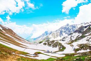 Landscape in the mountains. Panoramic view from the top of Sonmarg, Kashmir valley in the Himalayan region. meadows, alpine trees, wildflowers and snow on mountain in india. Concept travel nature. photo