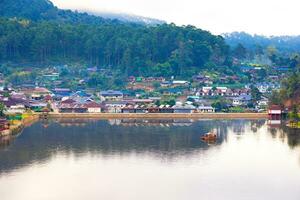 Ban Rak Thai, Mae Hong Son resort in green tea plantation on the hill and lake at village, chinese style hotel and resort, famous tourist attractions is another landmark of North Thailand. photo