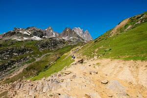 Landscape in the mountains. Panoramic view from the top of Sonmarg, Kashmir valley in the Himalayan region. meadows, alpine trees, wildflowers and snow on mountain in india. Concept travel nature. photo