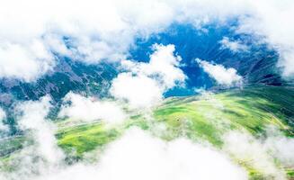 Landscape in the Himalayas Panoramic view from the top of Sonmarg, Nepal's Kashmir valley in the Himalayan region. Grasslands, wildflowers and mountain snow. hiking concept Nature camping, India photo