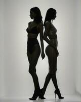 AI generated Silhouette of three women in black and white dresses, studio shot. ai generative photo