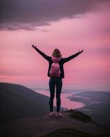 AI generated young woman hiker open arms on top of a mountain at sunrise. ai generative photo