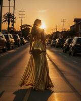 ai generado hermosa joven mujer en un largo amarillo vestir caminando en el calle a puesta de sol. ai generativo foto