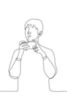 young man holds his smartphone horizontally he is distracted and looks to the side. one line drawing concept of interruption of online surfing, watching video, broadcasting, shooting video vector