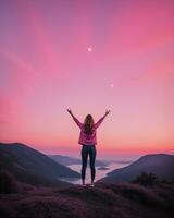 AI generated young woman hiker open arms on top of a mountain at sunrise. ai generative photo