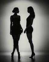 AI generated Silhouette of three women in black and white dresses, studio shot. ai generative photo