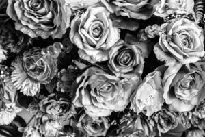 Close-up of decorative artificial flowers, full frame, background, wallpaper, black and white, sadness concept photo