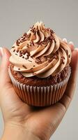 AI generated Chocolate cream sweet Cupcake cocoa powder on young hand photo