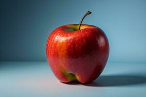 AI generated Red apple on a blue background. ai generated photo