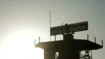 Airplane taking off together telecommunications radar tower at sunset video