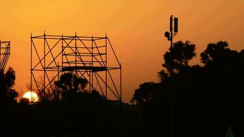 Sun hiding on structure of stage of music live at timelapse video