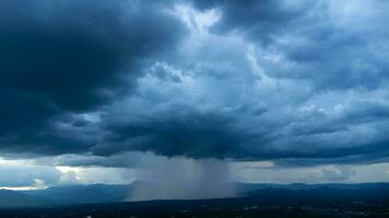 Aerial panoramic view of community and farmland with huge storm clouds in the background. Aerial view of the rain over a rural community. Rain clouds shot from a drone. photo