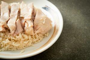 Hainanese chicken rice or rice steamed with chicken soup photo