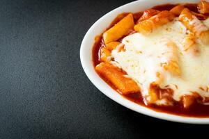 Korean rice cake in spicy Korean sauce with cheese, Cheese Tokpokki, Tteokbokki with Cheese photo