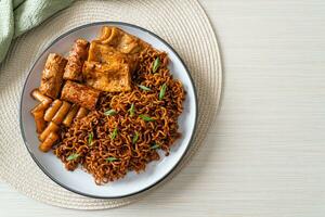 Jajangmyeon or JJajangmyeon with Odeng and Omuk - Korean Instant noodles with Korean fish cake in black bean sauce photo