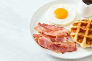 fried egg with bacon and waffle photo