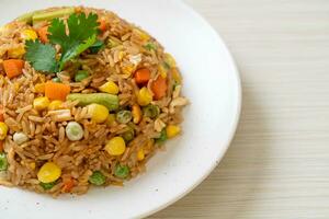 fried rice with green peas, carrot and corn photo