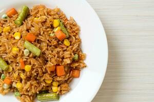 fried rice with green peas, carrot and corn photo