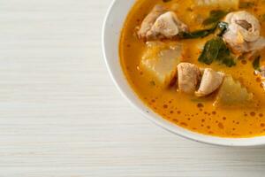 Chicken curry soup with roti photo