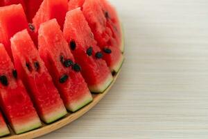 fresh watermelon sliced on plate photo