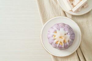 taro bun with white sugar cream and nut photo