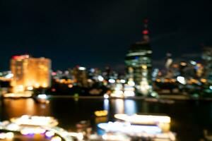 Desenfoque abstracto de la ciudad de Bangkok en Tailandia por la noche foto