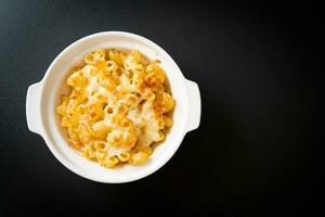 American mac and cheese, macaroni pasta in cheesy sauce photo