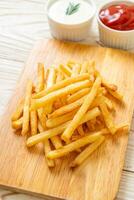 French fries with sour cream and ketchup photo