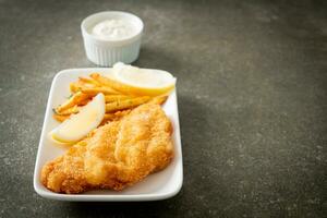 fish and chips - fried fish fillet with potatoes chips photo